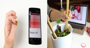 NailO allows for swipe gestures. An example scenario of NailO, where it's being used as remote controller for one-handed input, such as scrolling recipes online while cooking. 