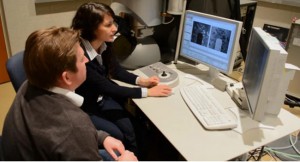 Scientists examine images from a scanning transmission electron microscope 