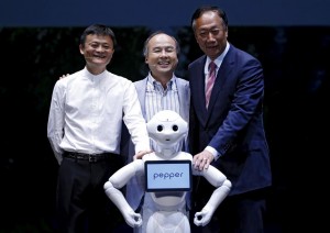 Son, Founder and CEO of Japan's SoftBank Corp., Gou, Founder and Chairman of Taiwan's Foxconn Technology and Ma, Founder and Executive Chairman of China's Alibaba Group pose with human-like robot 'pepper' in Chiba